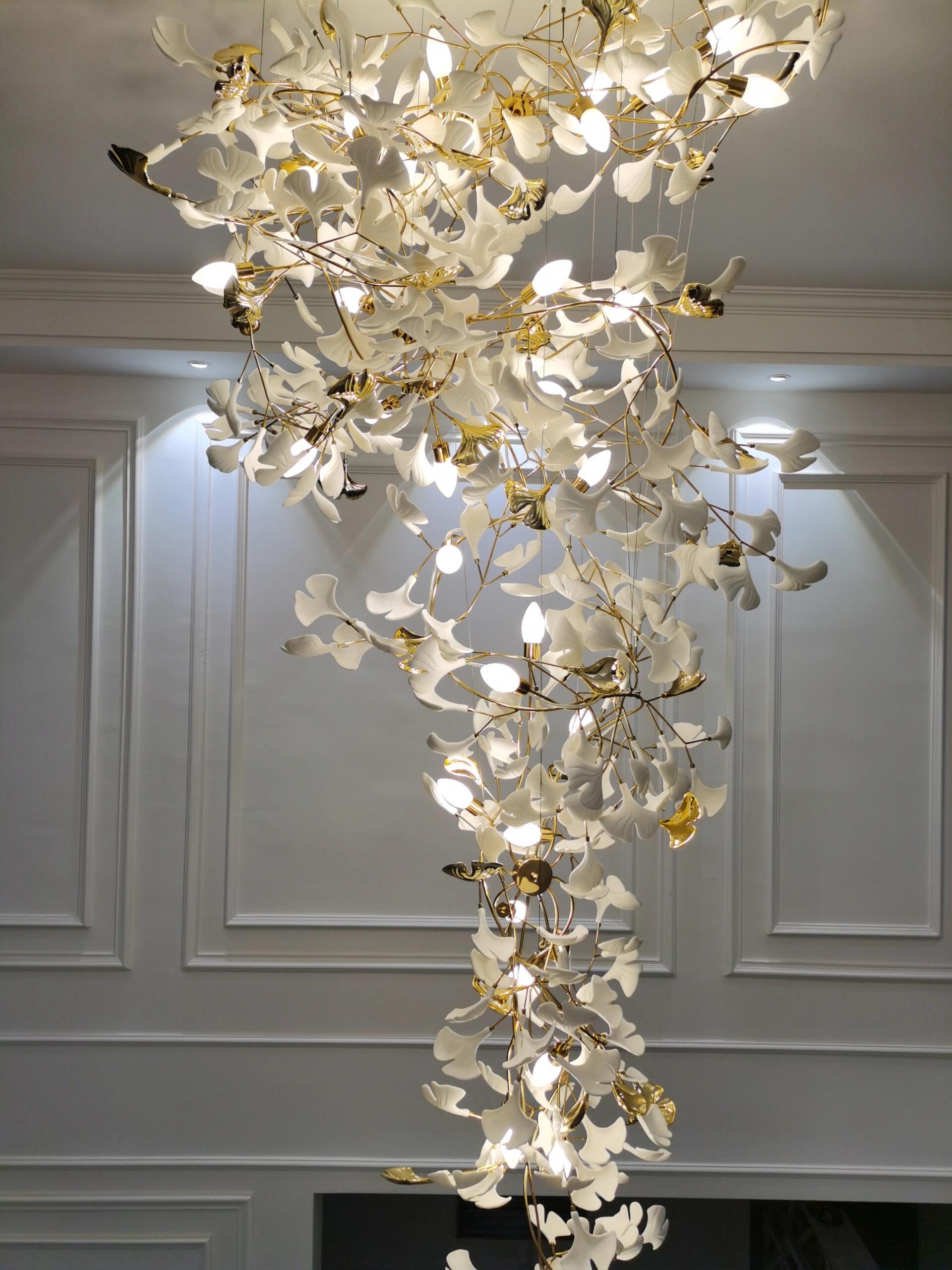 Artistic Tree Branch Pendant Light with Ceramic Ginkgo Leaves for High Ceilings in Hotel or Home - Riviko