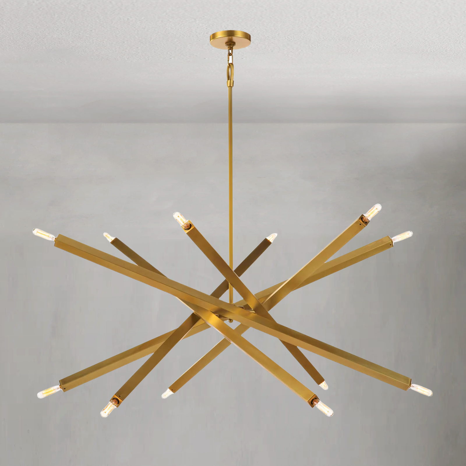 Riviko Kinetic Brass 12-Light Chandelier - American transitional great room with cathedral ceiling