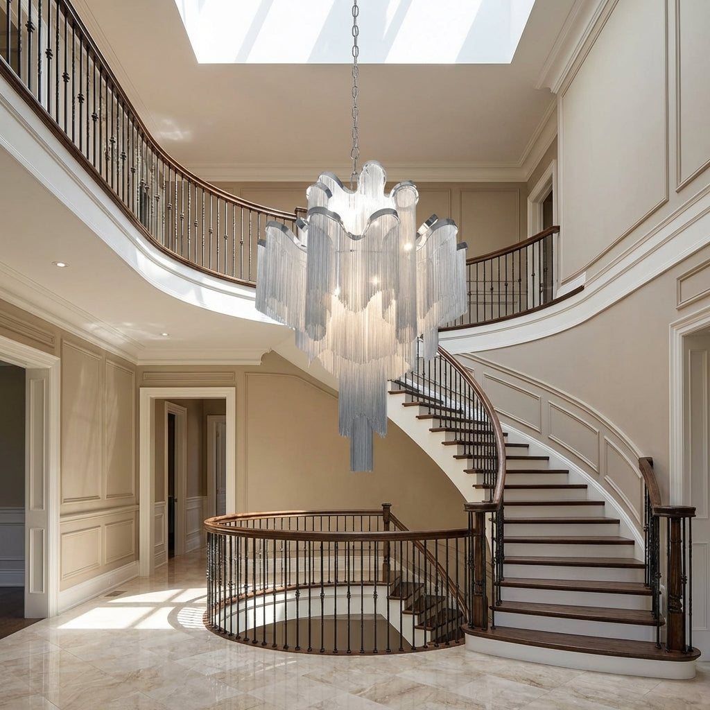 Riviko Grand Cascade Extra Large Stainless Steel Long Tassel Chandelier - dramatic American stairwell with soaring ceiling