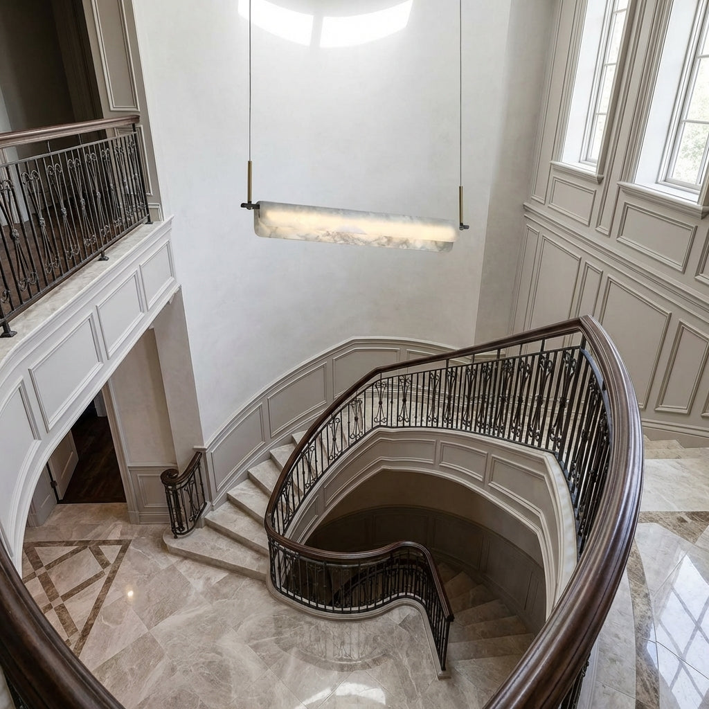 Riviko Opulent Alabaster Linear LED Chandelier - dramatic American stairwell with soaring ceiling