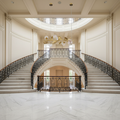 Riviko Organic Glass Bubble Brass Branch Chandelier with Leaves - dramatic American stairwell with soaring ceiling