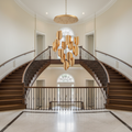 Riviko Tobey Round LED Chandelier - dramatic American stairwell with soaring ceiling