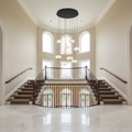 Riviko Lanterns 9 Light Round LED Chandelier - dramatic American stairwell with soaring ceiling
