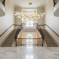 Riviko Ginkgo Bloom Ceramic Chandelier - dramatic American stairwell with soaring ceiling