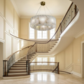 Riviko Alabaster Radiance Round Chandelier - dramatic American stairwell with soaring ceiling