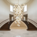 Riviko Ginkgo Canopy Branch Chandelier - dramatic American stairwell with soaring ceiling