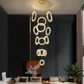 Riviko Aura Grandeur Multi-Ring Round Chandelier - American transitional great room with cathedral ceiling