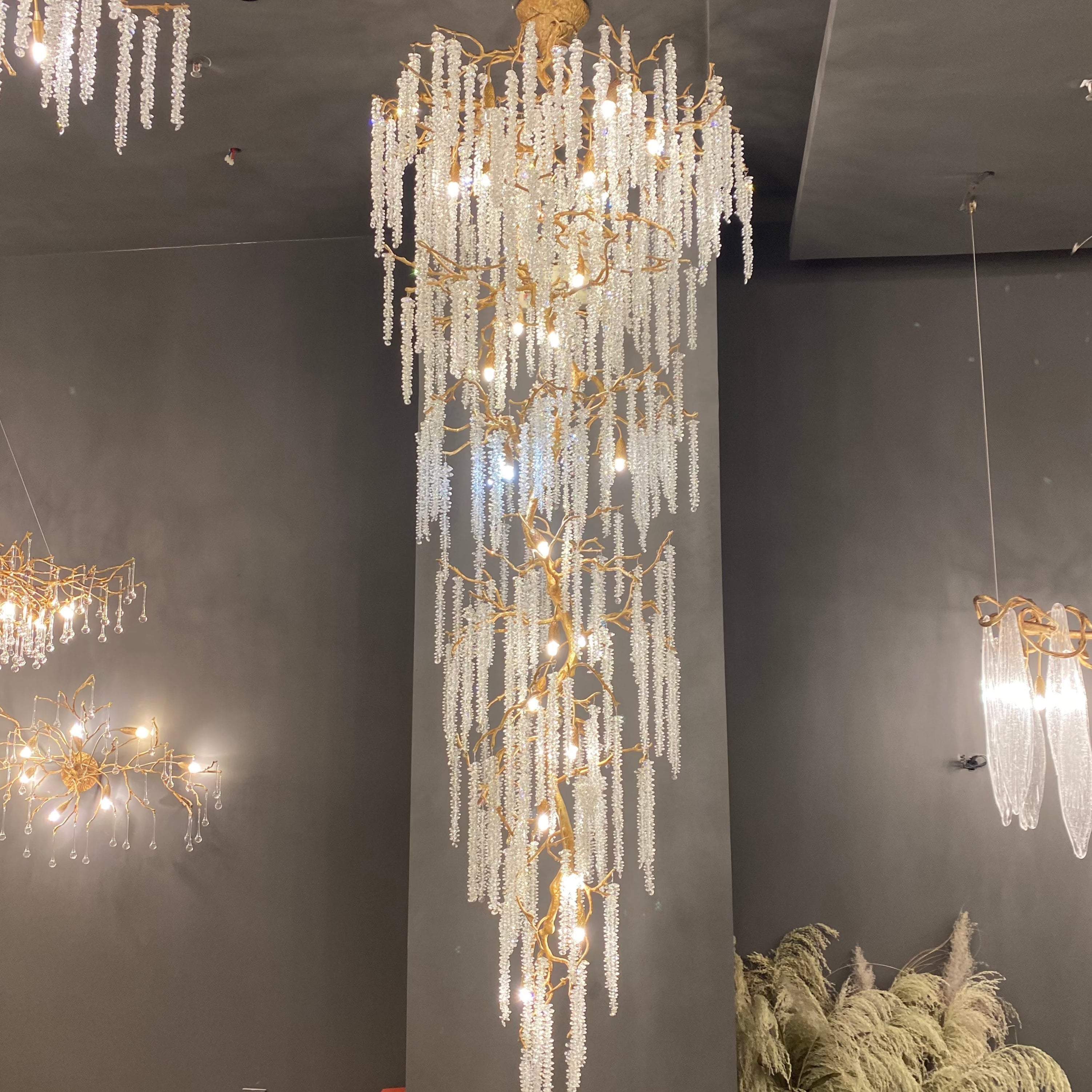 Riviko Celestial Branch Grand Crystal Chandelier - dramatic American stairwell with soaring ceiling
