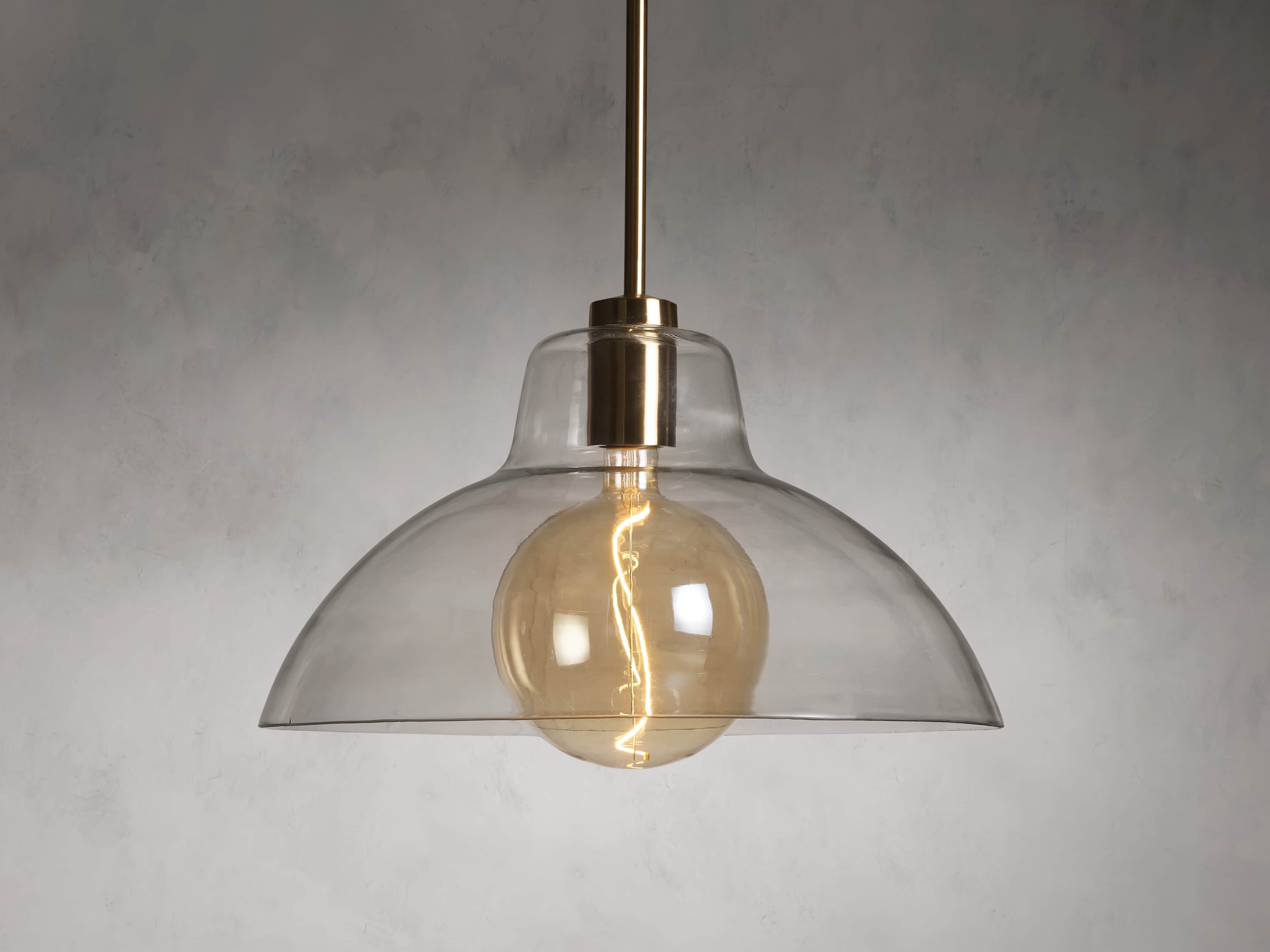 Riviko Veridian Dome Brass Pendant - dramatic American stairwell with three-story void