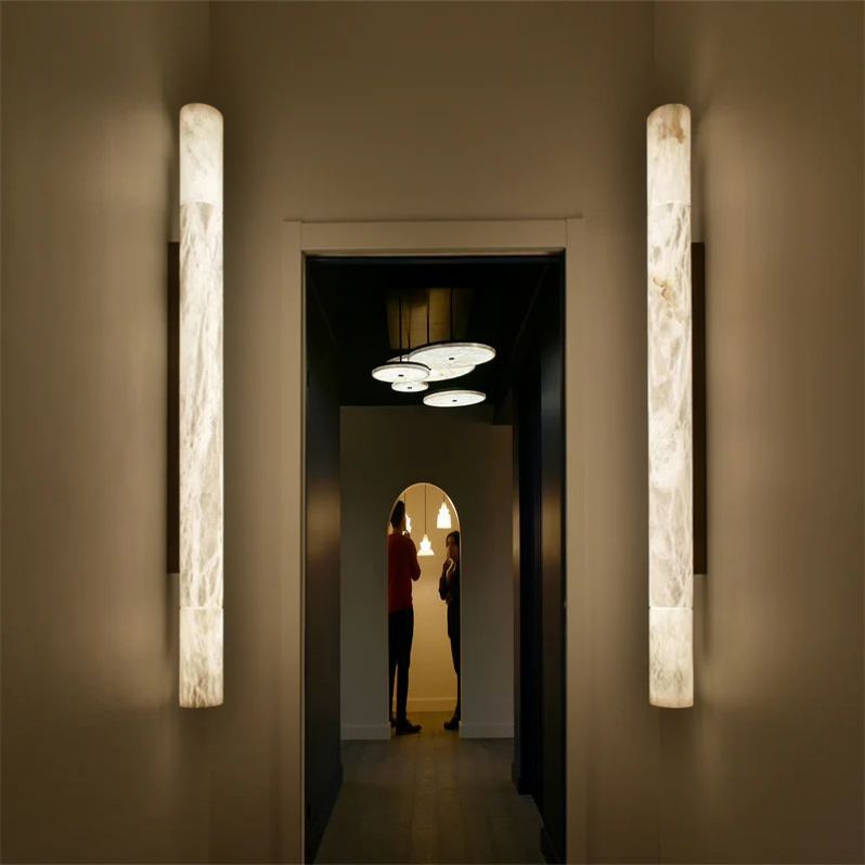 Riviko Alabaster Aura Round Wall Sconce - dramatic American stairwell with soaring ceiling
