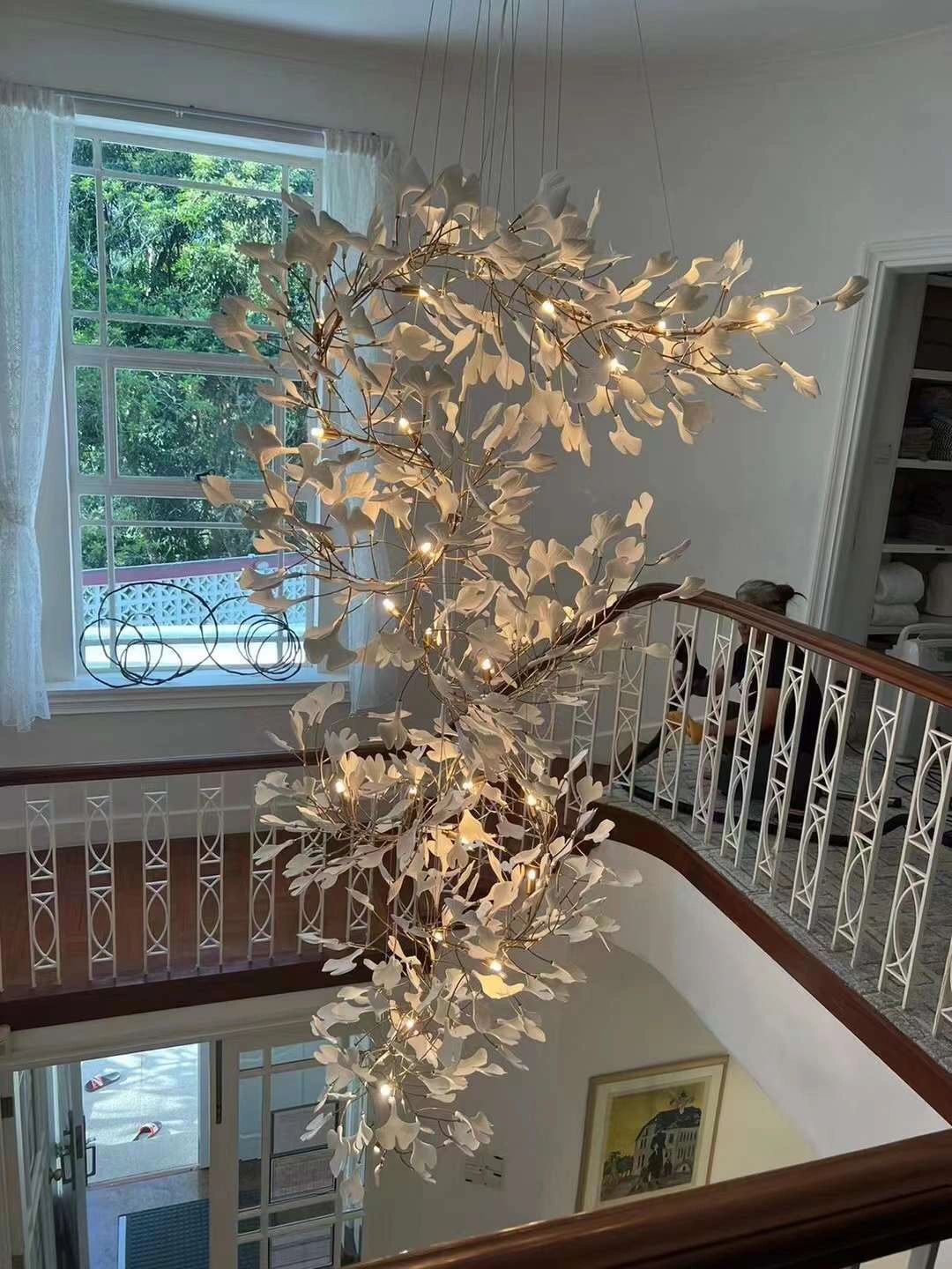 Artistic Tree Branch Pendant Light with Ceramic Ginkgo Leaves for High Ceilings in Hotel or Home - Riviko