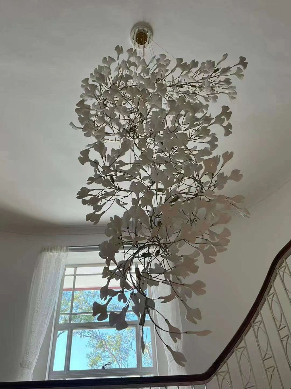 Artistic Tree Branch Pendant Light with Ceramic Ginkgo Leaves for High Ceilings in Hotel or Home - Riviko