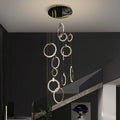 Riviko Radiant Aura 12-Ring Crystal Chandelier - American formal living room with 12-foot ceilings