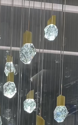 Riviko Grand Lumina Modern K9 Crystal Chandelier - Background Shot