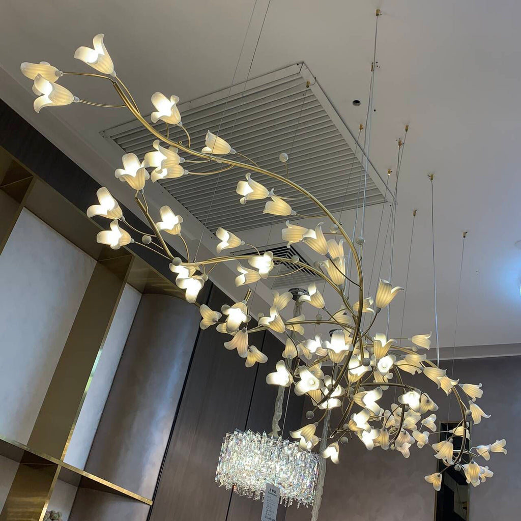 Riviko Botanical Bloom Brass Ceramic Chandelier - American transitional great room with cathedral ceiling