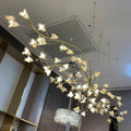 Riviko Botanical Bloom Brass Ceramic Chandelier - American transitional great room with cathedral ceiling